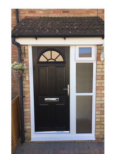 Black composite front door with side panel and top hopper