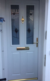 Dorset Black Cavana white composite front door with flag window