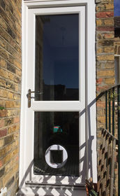 Fully Glazed with Midrail white upvc back door with catflap