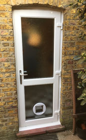 Fully Glazed with Midrail white upvc back door with catflap