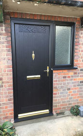 Norfolk black composite front door with flag window