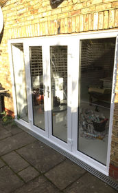 White upvc french doors with side panels