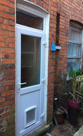 Cardiff Attina white upvc back door with catflap and toplight