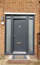 Norfolk anthracite grey composite front door with toplights & side panels